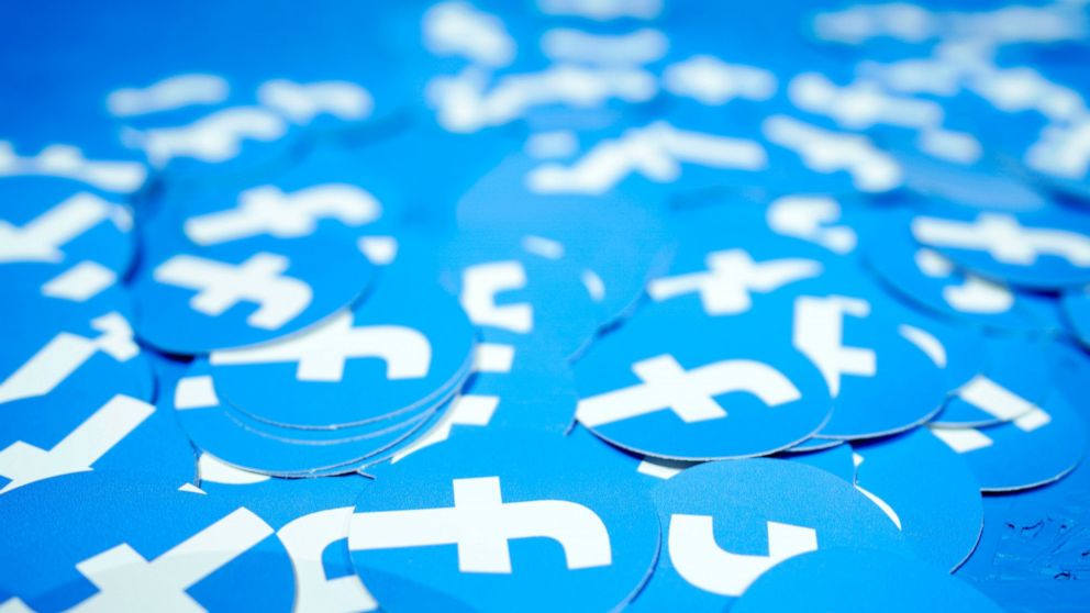 FILE - In this April 30, 2019, file photo, Facebook stickers are laid out on a table at F8, Facebook's developer conference in San Jose, Calif. The Boston-based renewable energy developer Longroad Energy announced in May that Facebook is building a m