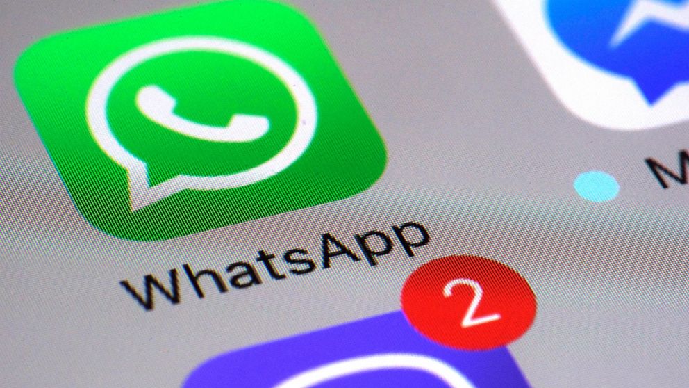 FILE - This Friday, March 10, 2017, file photo shows the WhatsApp communications app on a smartphone, in New York. In early January 2021, encrypted messaging apps Signal and Telegram are seeing huge upticks in downloads from Apple and Google's app st