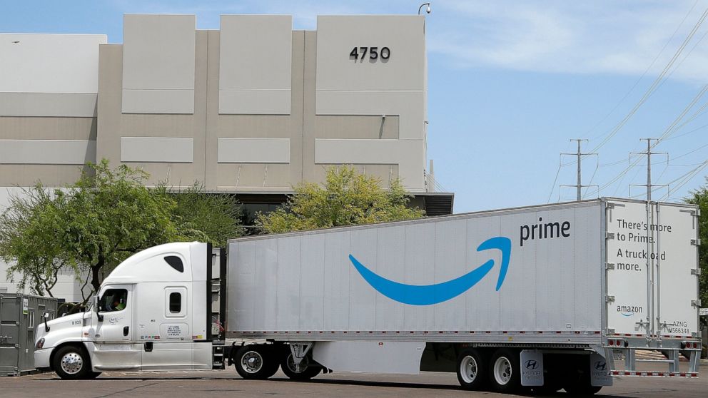This Wednesday, July 17, 2019 photo shows an Amazon shipping truck at a fulfillment center in Phoenix. Amazon.com Inc. reports financial earnings on Thursday, July 25. (AP Photo/Ross D. Franklin)