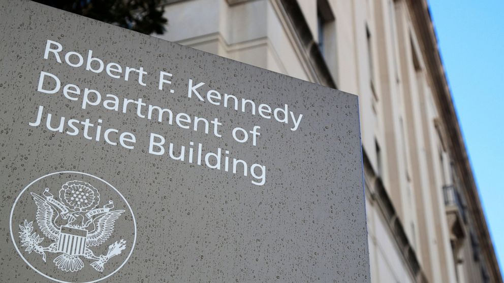 FILE - This Friday, March 22, 2019, file photo shows the Department of Justice Building in Washington. The U.S. Department of Justice is opening a sweeping antitrust investigation of major technology companies and whether their online platforms have 