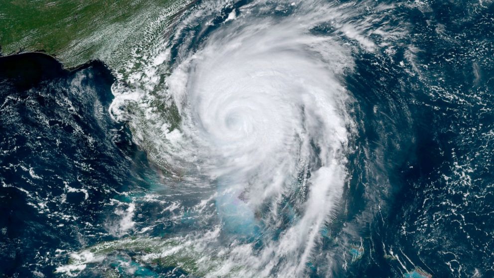 This GOES-16, GeoColor satellite image taken Tuesday, Sept. 3, 2019, at 17:10 UTC and provided by National Oceanic and Atmospheric Administration (NOAA), shows Hurricane Dorian moving off the east coast of Florida in the Atlantic Ocean. (NOAA via AP)