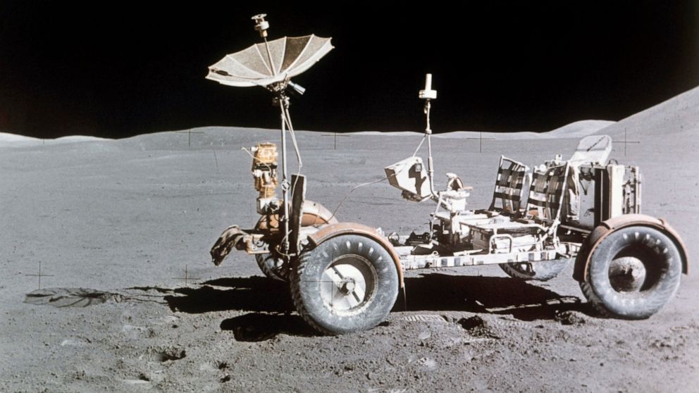 FILE - Rover alone, looking north, on the west edge of Mount Hadley is at upper right edge of picture, the most distant lunar feature visible is about 25 kilometers away, Aug. 1971. Goodyear is teaming with Lockheed Martin on the development of a veh
