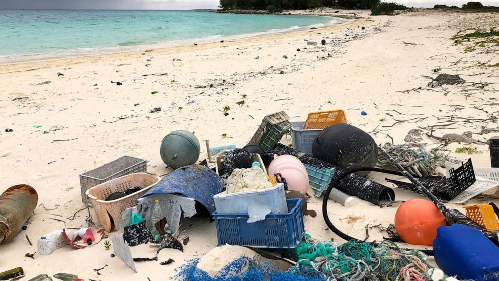 FILE - In this Oct. 22, 2019, photo, plastic and other debris is seen on the beach on Midway Atoll in the Northwestern Hawaiian Islands. America needs to rethink and reduce the way it generates plastics because so much of it is littering the oceans, 