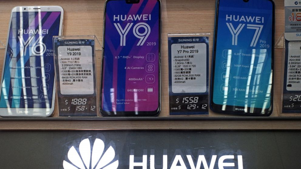 FILE - In this Friday, March 29, 2019 file photo, Huawei mobile phones are displayed at a telecoms service shop in Hong Kong. The top U.S. diplomat for cybersecurity policy has praised Germany's draft security standards for next generation mobile net