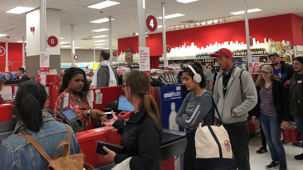 Customers wait on a long check out line at a Target store in San Francisco on Saturday, June 15, 2019. Target suffered a technological glitch that stalled checkout lines at its stores worldwide Saturday, exasperating shoppers and eating into sales at