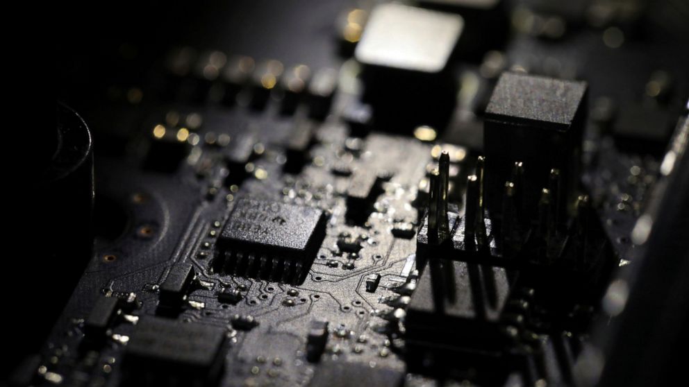 FILE - This Feb 23, 2019, file photo shows the inside of a computer in Jersey City, N.J. Facebook unveiled a broad plan Tuesday, June 18, to create a new digital currency. (AP Photo/Jenny Kane, File)