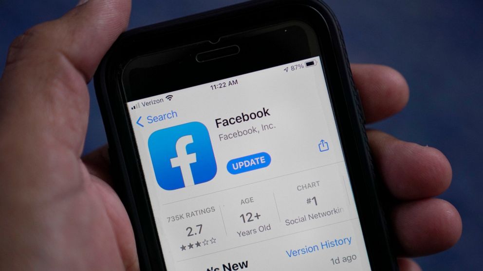 FILE - The Facebook app is shown on a smart phone in Surfside, Fla., Friday, April 23, 2021. Meta Platforms said Thursday, July 28, 2022, it will no longer pay U.S. news organizations to have their material appear in Facebook's News Tab as it realloc
