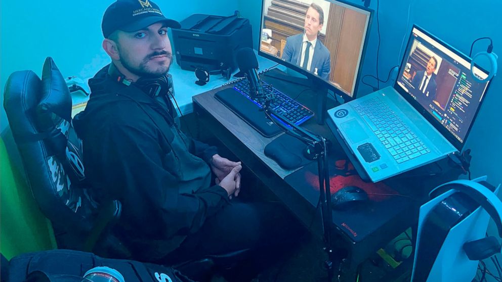 Andrew Mercado of Mercado Media monitors his streams of the Kyle Rittenhouse trial from his home setup in White Bear Lake, Minn., on Thursday Nov. 4, 2021. Mercado has been streaming the trial on YouTube and Facebook for eight hours a day since the p