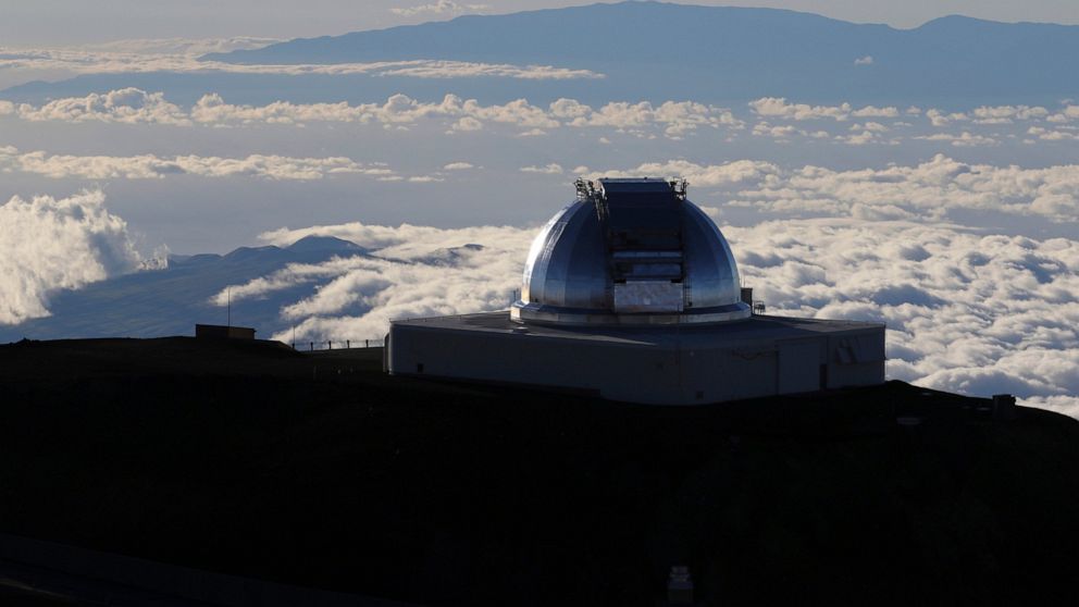 FILE - In this July 14, 2019, file photo, a telescope at the summit of Mauna Kea, Hawaii's tallest mountain is viewed. Astronomers across 11 observatories on Hawaii’s tallest mountain have cancelled more than 2,000 hours of telescope viewing over the
