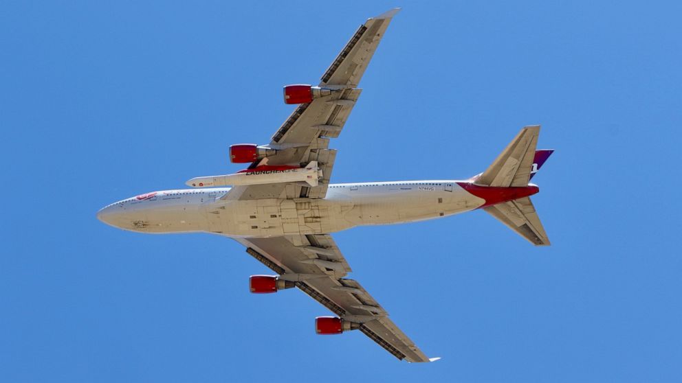 A Virgin Orbit Boeing 747-400 aircraft named Cosmic Girl takes off from Mojave Air and Space Port in the desert north of Los Angeles Monday, May 25, 2020. Richard Branson's Virgin Orbit failed Monday in its first test launch of a new rocket carried a