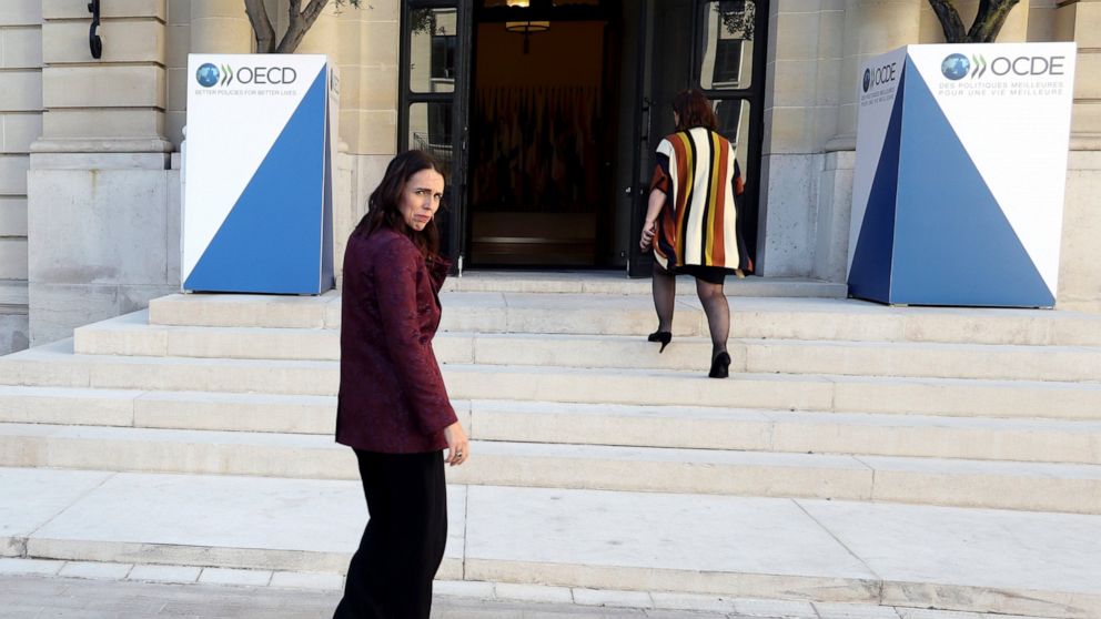 New Zealand Prime Minister Jacinda Ardern, left, leaves after a press conference, at the OECD headquarters, in Paris, Tuesday, May 14, 2019. The leaders of France and New Zealand will make a joint push to eliminate acts of violent extremism from bein