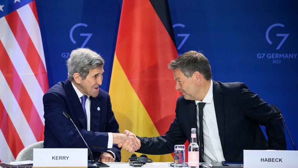 German Economy and Climate Minister Robert Habeck, right, and John Kerry, left, Special Envoy of the U.S. President for Climate, shake hands after they signed a declaration of intent to establish a German-American climate and energy partnership betwe