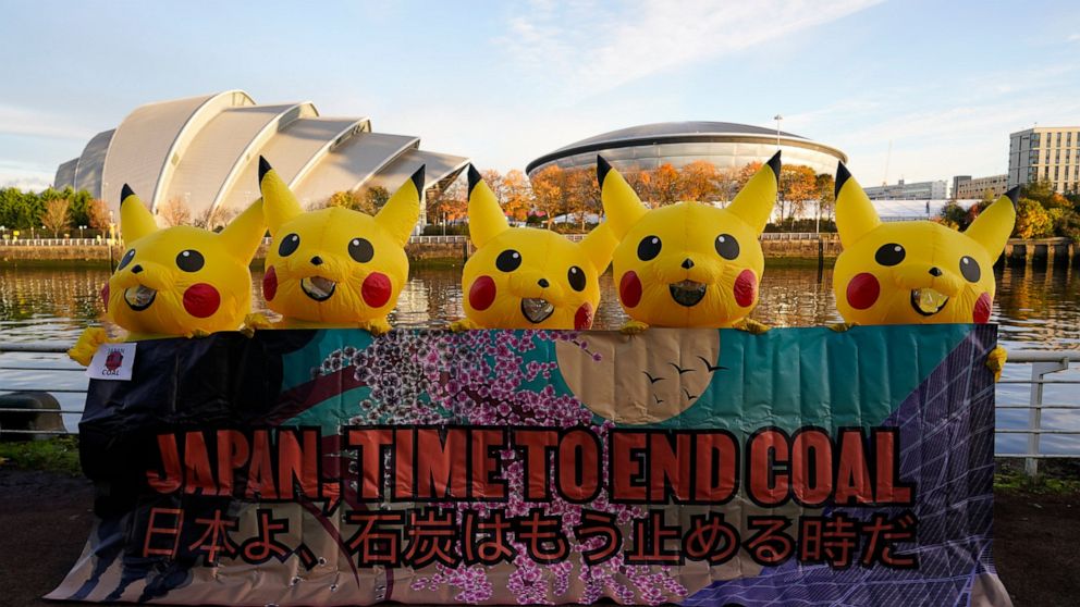 Activists dressed as the Pokemon character Pikachu protest against Japan's support of the coal industry near the COP26 U.N. Climate Summit in Glasgow, Scotland, Thursday, Nov. 4, 2021. The U.N. climate summit in Glasgow gathers leaders from around th