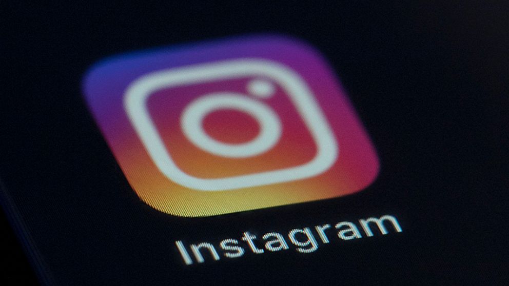 FILE - This Friday, Aug. 23, 2019, file photo shows the Instagram app icon on the screen of a mobile device in New York. Facebook says it’s going to test out, again, an option for users to hide those “like” counts to see if it can reduce the pressure