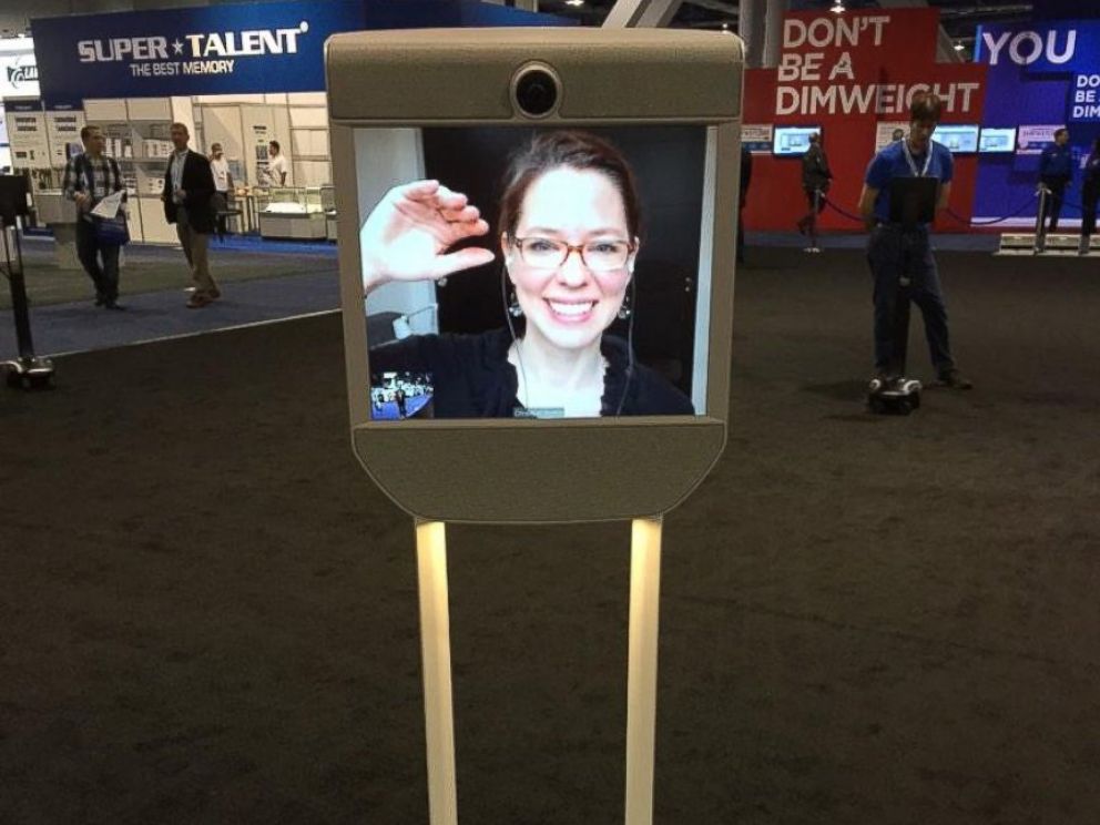 PHOTO: ABC News Neal Karlinsky talks to a woman who telecommutes out of state via this remote-controlled robot on wheels at CES 2015 on Jan. 7, 2015.