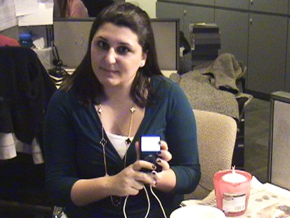 Picture of Emily Friedman holding an iPod.
