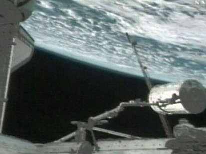 VIDEO: Spacewalking astronauts hook up new chamber to the International Space Station.