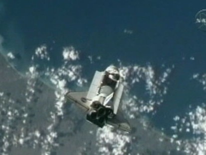 VIDEO: Space shuttle Discovery approaches space station for 9-day visit.