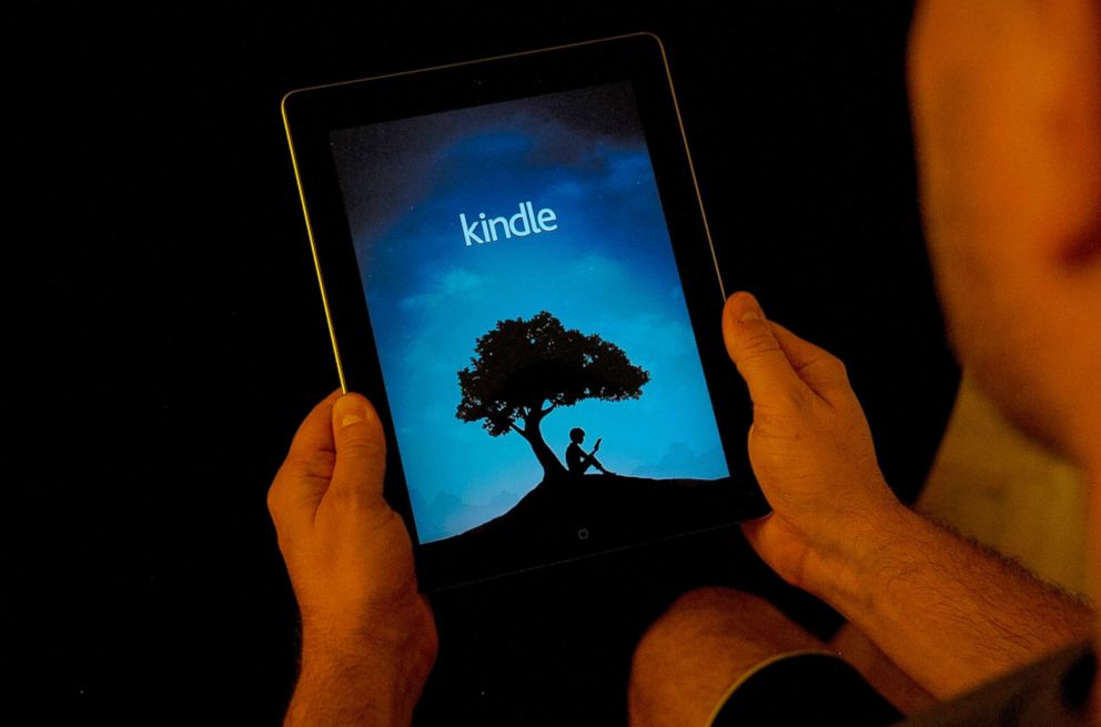 PHOTO: A man is seen using the Amazon Kindle application on an iPad, Nov. 2, 2017.