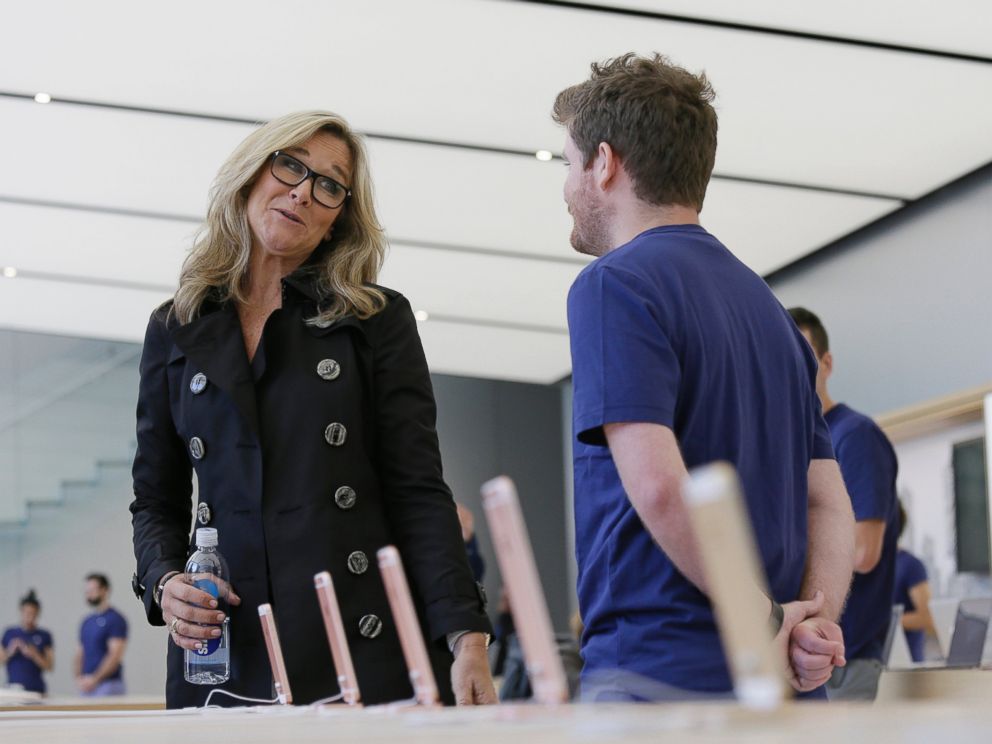 Angela Ahrendts, Apples senior vice president of retail and online stores, speaks with an employee during a preview of the new Apple Union Square store, Thursday, May 19, 2016, in San Francisco.