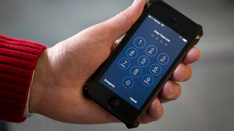 A person holds an Apple iPhone in Washington, D.C., Feb. 17, 2016.