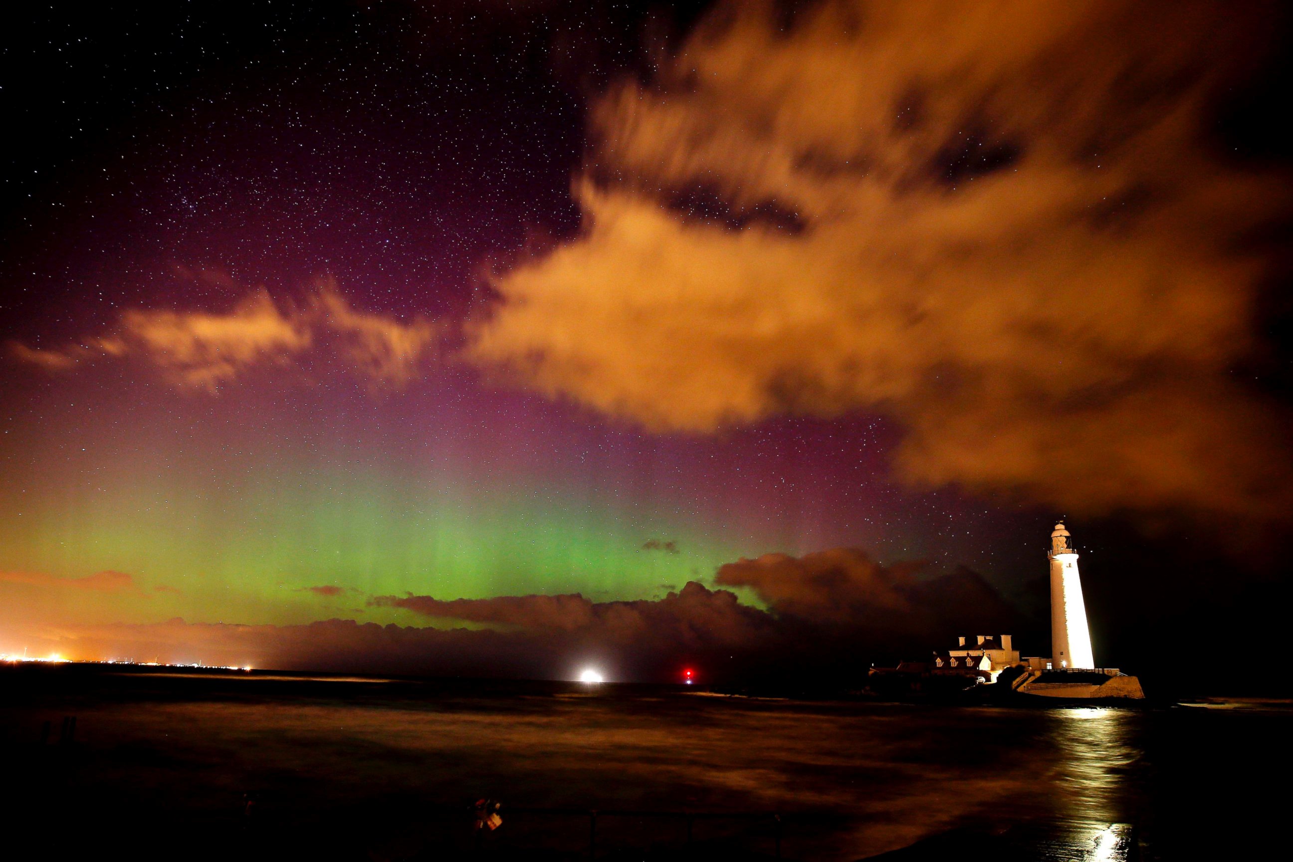 PHOTO: The Northern Lights, or Aurora Borealis, shine over St Marys Lighthouse near Whitley Bay in Northumberland, northeast England early March 7, 2016.