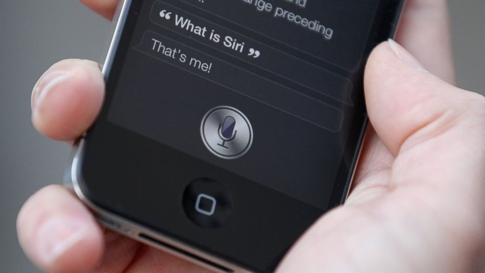 A man uses Siri on an iPhone 4S on Oct. 14, 2011 in London, England.