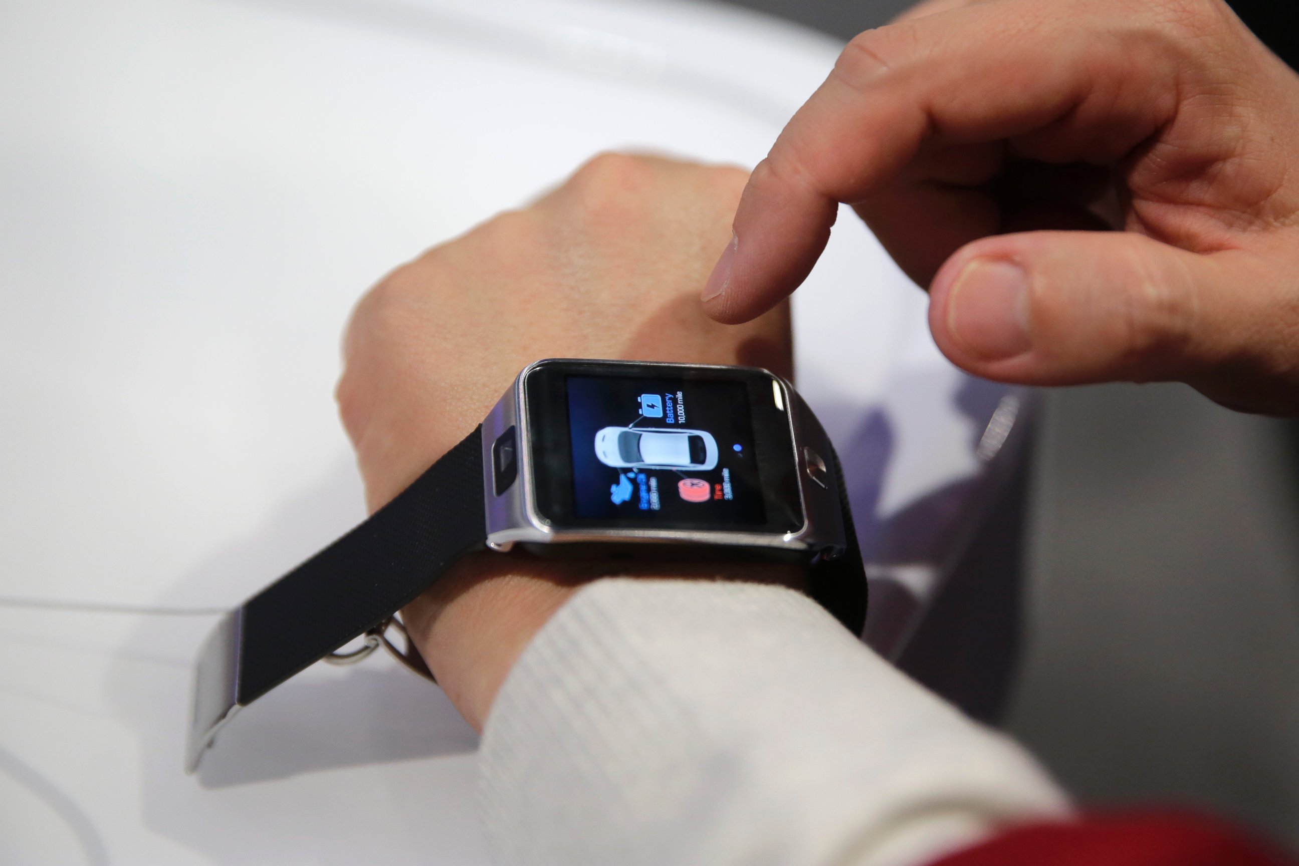 PHOTO: An attendee tries out a wearable device that allows drivers to connect with their cars at the Hyundai booth at the International CES Tuesday, Jan. 6, 2015, in Las Vegas.