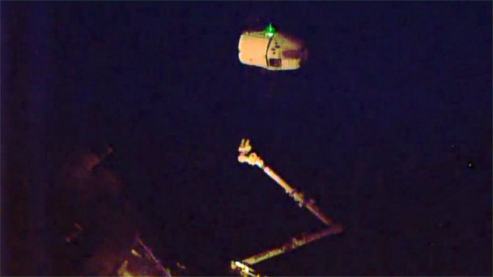 In this photo provided by NASA TV, the SpaceX Dragon is released from the International Space Station on Thursday, May 21, 2015,  and begins its departure to Earth.  I