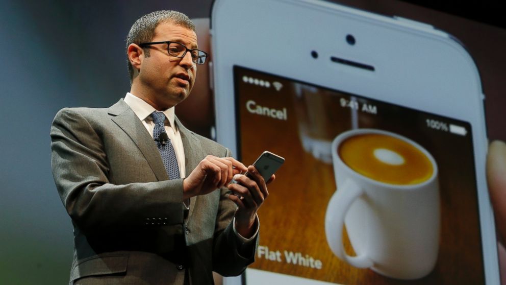 Adam Brotman, Starbucks chief digital officer, talks about the company's new mobile ordering app at Starbucks Coffee Company's annual shareholders meeting in Seattle, March 18, 2015.