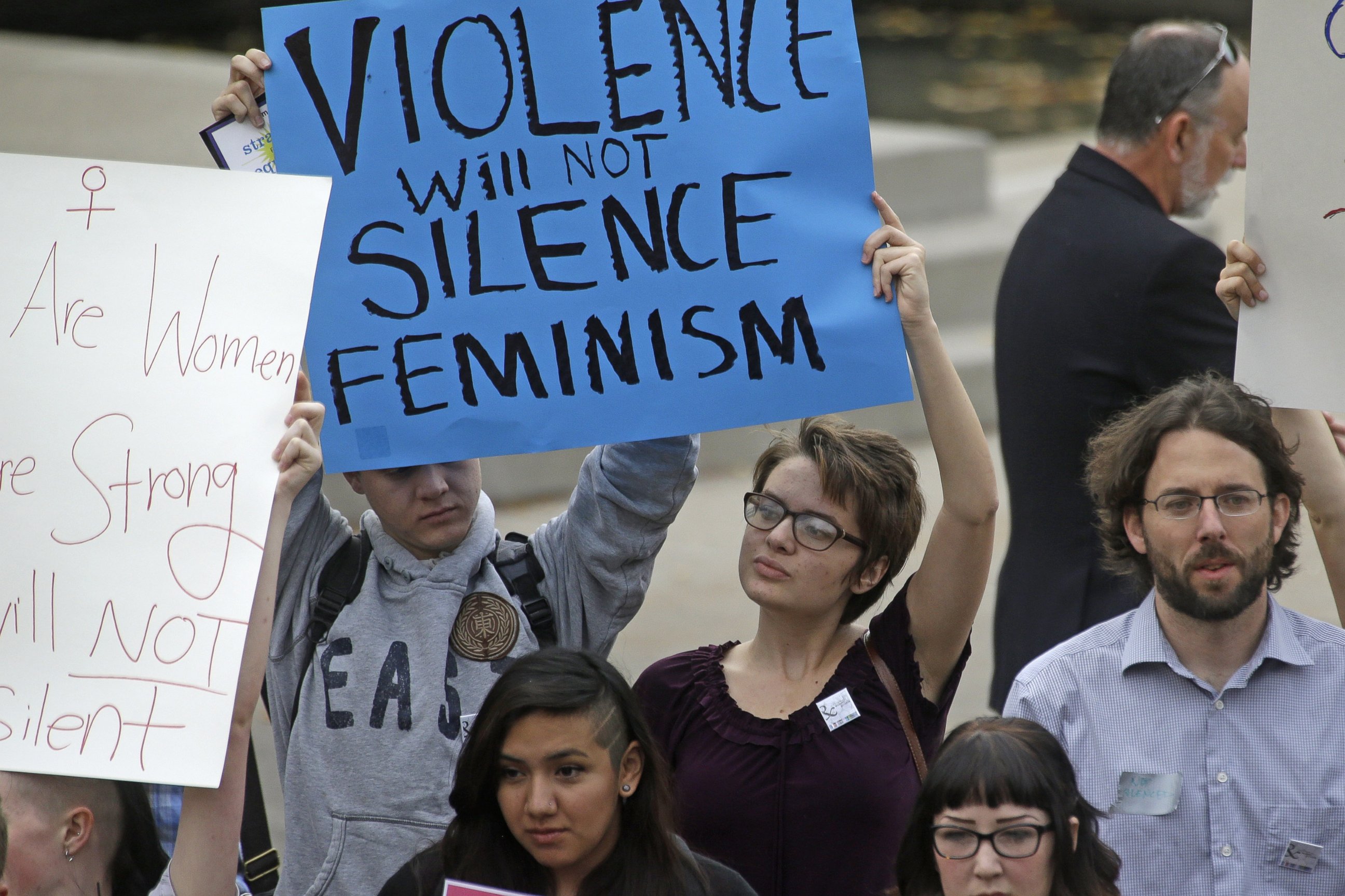 PHOTO: People protest on the campus of Utah State, Oct. 15, 2014, in Logan, Utah.