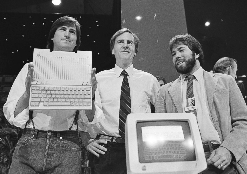 PHOTO: In this April 24, 1984 file photo, Steve Jobs, left, chairman of Apple Computers, John Sculley, center, president and CEO, and Steve Wozniak, co-founder of Apple, unveil the new Apple IIc computer in San Francisco.