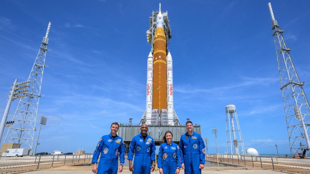 PHOTO: Astronauts Reid Wiseman, Victor Glover, Christina Koch and Jeremy Hansen stop for a group photo during a visit to NASA's Artemis II SLS rocket and Orion spacecraft, March 30, 2026, at Launch Complex 39B of NASA's Kennedy Space Center in Fla. 