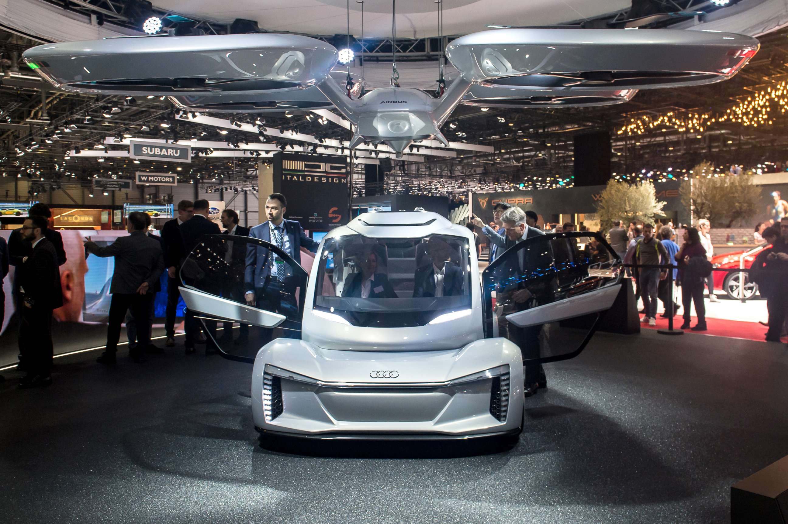 PHOTO: The "Pop.up next" concept flying car, a hybrid vehicle that blends a self-driving car and passenger drone by Audi, italdesign and Airbus is seen at the 88th Geneva International Motor Show, March 6, 2018, in Geneva, Switzerland. 