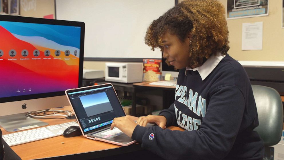 PHOTO: Spellman computer science major Madeline Brown shows off her video game.