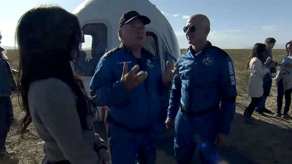 PHOTO: New Shepard NS-18 mission crew member "Star Trek" actor, William Shatner speaks with Blue Origin founder Jeff Bezos on Oct. 13, 2021, after landing in the West Texas region, 25 miles  north of Van Horn. 