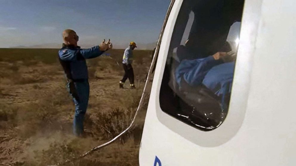 PHOTO: Blue Origin founder Jeff Bezos gives the thumbs up to the New Shepard NS-18 mission crew members after landing on Oct. 13, 2021, in the West Texas region, 25 miles north of Van Horn.