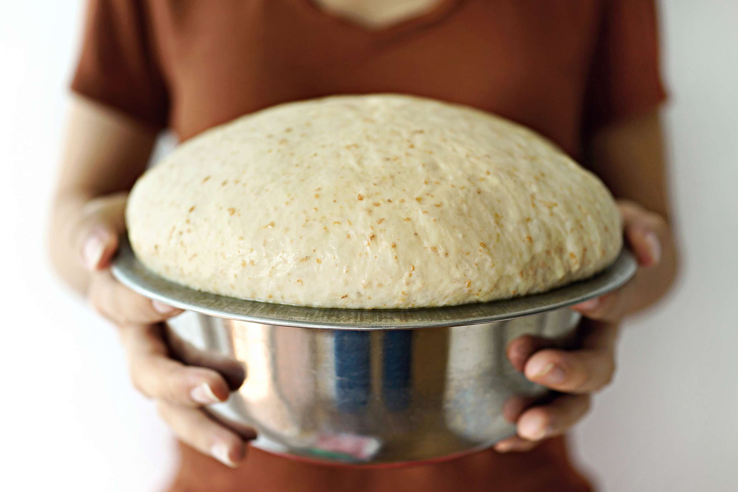 PHOTO: In this undated file photo, a person holds a bowl of risen bread dough.