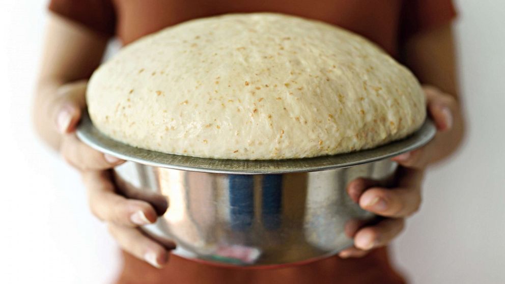 PHOTO: In this undated file photo, a person holds a bowl of risen bread dough.