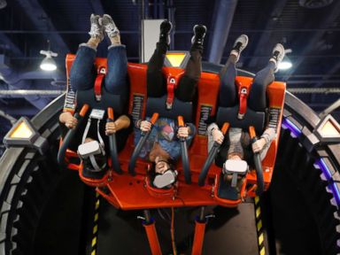 PHOTO: People ride the Hurricane VR 360 at the DOF Robotics booth at CES, Jan. 9, 2019, in Las Vegas.