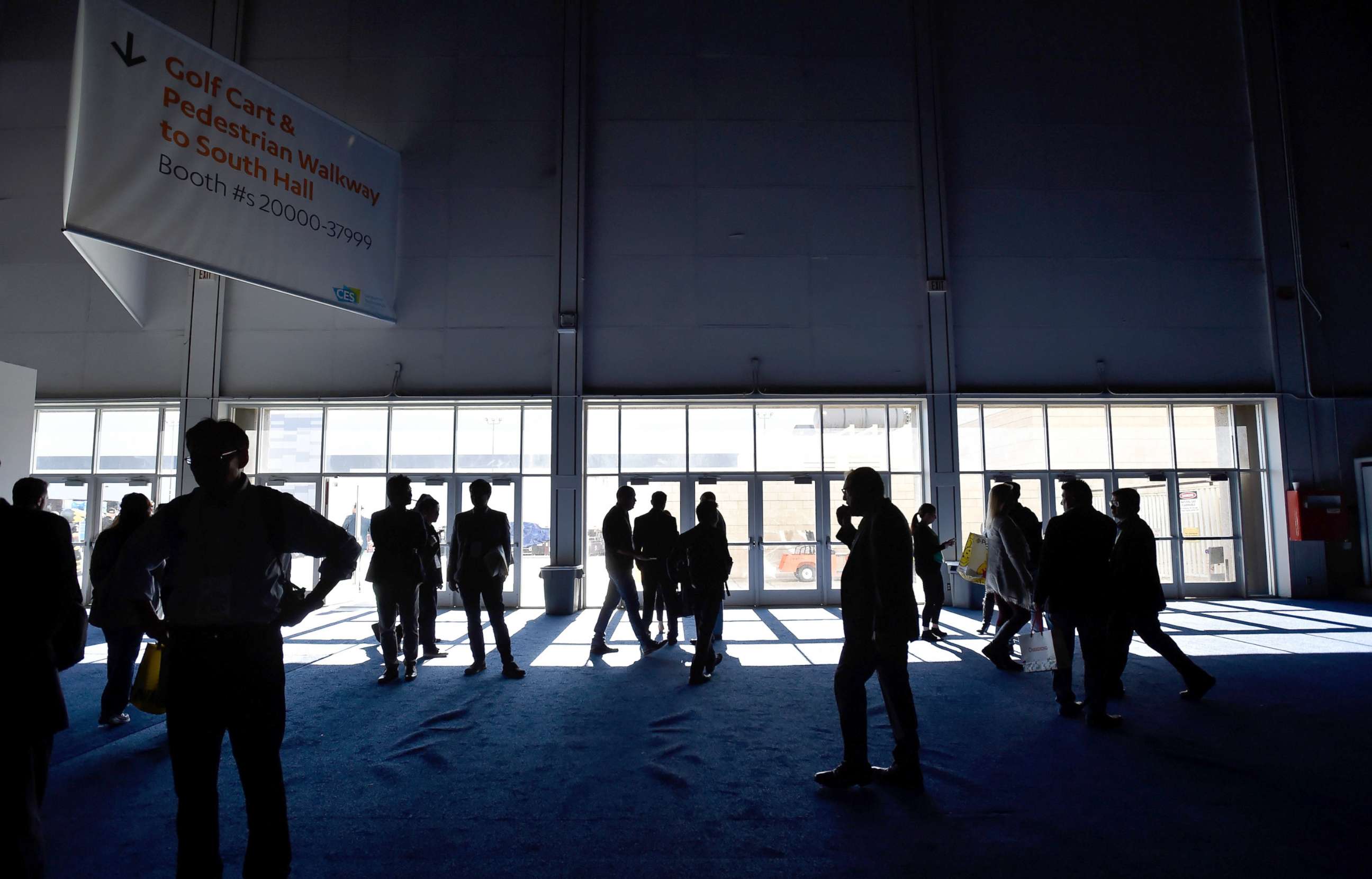 PHOTO: Attendees stand around after the power went out during CES 2018 inside the central hall at the Las Vegas Convention Center, Jan. 10, 2018, in Las Vegas.