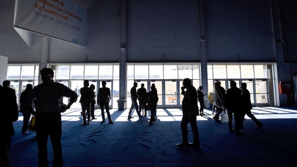 PHOTO: Attendees stand around after the power went out during CES 2018 inside the central hall at the Las Vegas Convention Center, Jan. 10, 2018, in Las Vegas.