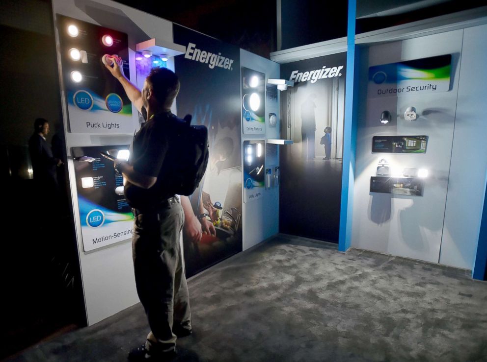 PHOTO: Attendee John Parmley looks over battery-operated lighting in the Jasco Products booth after power was lost during CES 2018 inside the central hall at the Las Vegas Convention Center, Jan. 10, 2018, in Las Vegas.