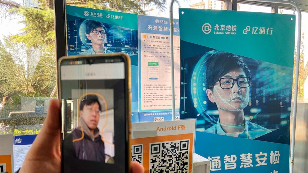 PHOTO: A person shows the facial recognition shown through the app at the Fuchengmen subway station in Beijing, China, Nov. 28, 2019.