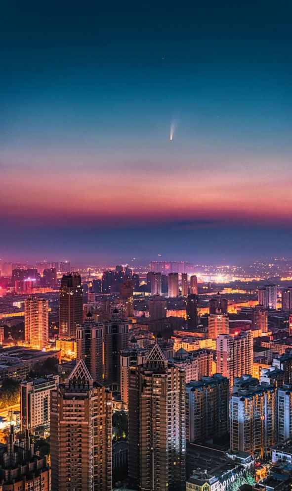 PHOTO: Comet Neowise is seen over Harbin City, Heilongjiang Province, China, July 9, 2020.