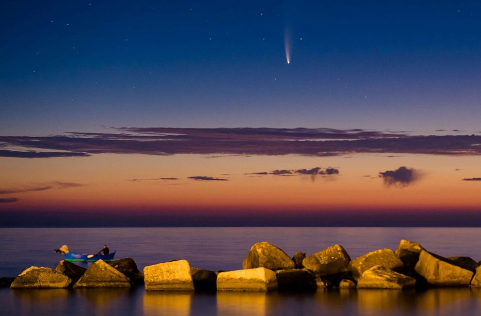 PHOTO: Comet NEOWISE is seen at sunset above the Port of Molfetta in Molfetta, Italy on July 11, 2020.