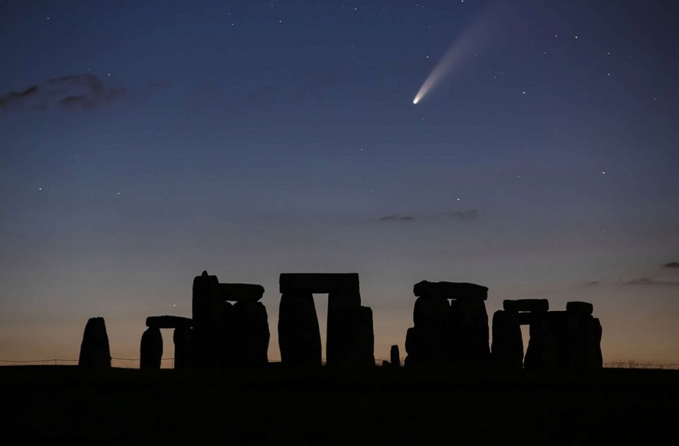 PHOTO: Comet NEOWISE is seen passing over Stonehenge, July 12, 2020.