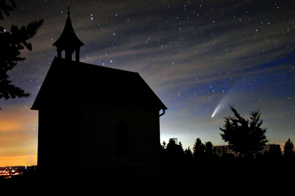 PHOTO: Comet Neowise is seen next to the Memorial Chapel on the Haunsberg in Salzburg, Austria on July 13, 2020.