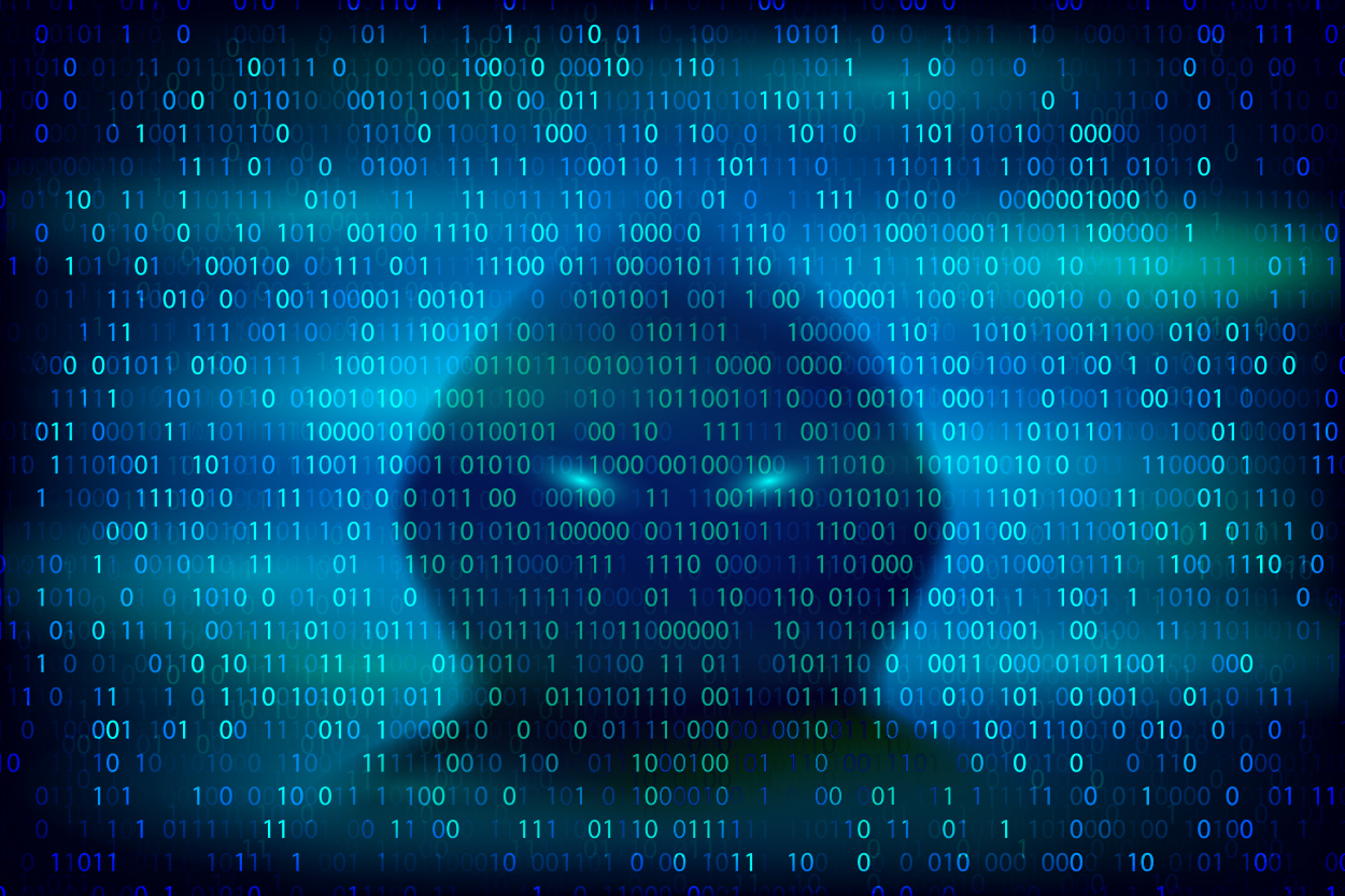 PHOTO: A silhouette of a hacker on the background with binary code is pictured in this undated stock photo. 