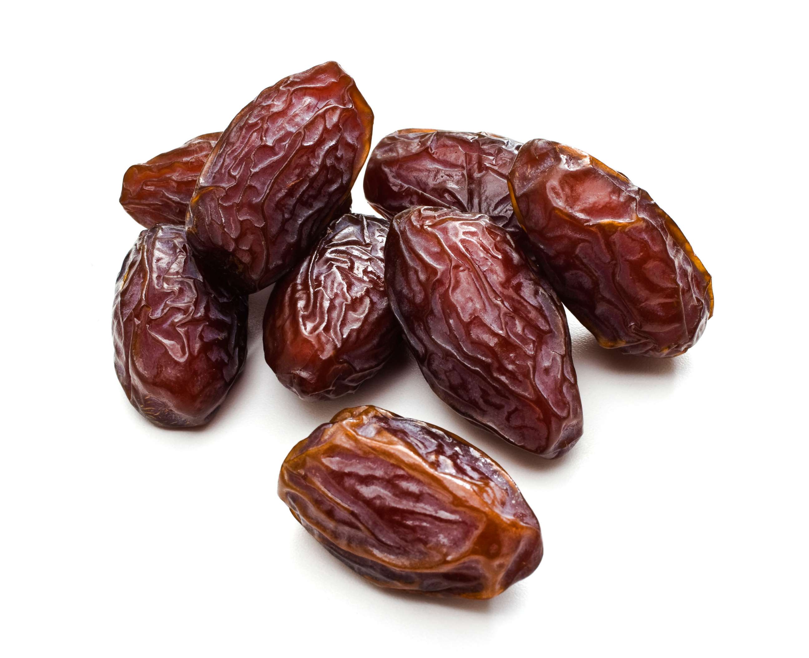 PHOTO: Date fruit on a white background.